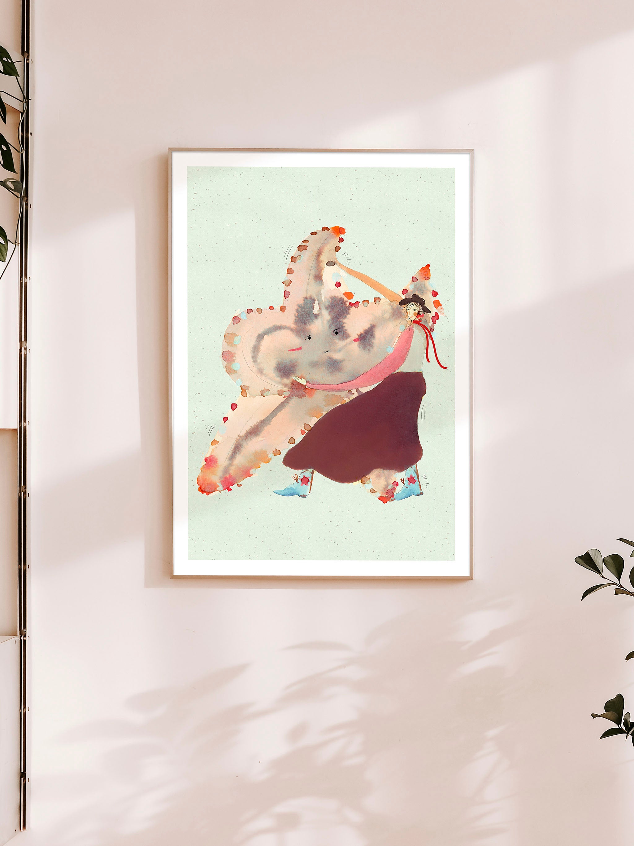 Søstjernedans kunstplakat med dansende person og stor søstjerne på en lys væg
